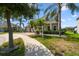 Charming two-story home with a brick driveway, two-car garage, well-manicured lawn, and sidewalk at 4950 Chase Ct, St Cloud, FL 34772