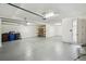 Spacious garage with clean floor and modern lighting fixtures at 4950 Chase Ct, St Cloud, FL 34772