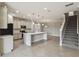 Open-concept kitchen featuring a large island, tile flooring, and modern appliances at 4950 Chase Ct, St Cloud, FL 34772
