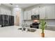 Spacious kitchen featuring an island, stainless steel appliances, and ample cabinet space at 4950 Chase Ct, St Cloud, FL 34772