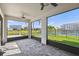 Screened lanai with brick floor and views of the lush backyard at 4950 Chase Ct, St Cloud, FL 34772