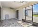 Spacious screened-in lanai features brick flooring, ceiling fan, and sliding glass doors to the home's interior at 4950 Chase Ct, St Cloud, FL 34772