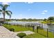 Breathtaking lake view with a well-maintained dock and lush green surroundings enhance this home's appeal at 4950 Chase Ct, St Cloud, FL 34772