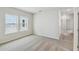 Well-lit bedroom features soft carpet, ample windows, and neutral wall color at 6690 Wake St, St Cloud, FL 34771
