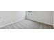 This bedroom features neutral walls, white trim, carpet flooring, and a window at 6690 Wake St, St Cloud, FL 34771