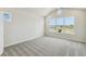 Large bedroom with vaulted ceilings and views of the neighborhood at 6690 Wake St, St Cloud, FL 34771