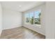 Bright bedroom with hardwood floors and large windows offering plenty of natural light at 6690 Wake St, St Cloud, FL 34771