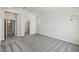 Bedroom features neutral carpeting and doorway leading to a walk-in closet at 6690 Wake St, St Cloud, FL 34771