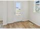 Bright entryway with a glass door and beautiful hardwood flooring at 6690 Wake St, St Cloud, FL 34771