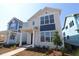 Charming two-story home with a modern design, large windows, and a welcoming front porch at 6690 Wake St, St Cloud, FL 34771