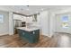 Modern kitchen features a center island, stainless appliances, and bright lighting at 6690 Wake St, St Cloud, FL 34771