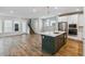 Open kitchen with an island and stainless steel appliances in a spacious living area at 6690 Wake St, St Cloud, FL 34771