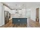 Bright kitchen boasts a center island, stainless appliances, and ample counter space at 6690 Wake St, St Cloud, FL 34771