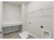 This laundry room features a countertop, shelf, and washer/dryer hookups at 6690 Wake St, St Cloud, FL 34771