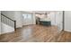Expansive open floor plan featuring wood-look floors and a modern kitchen with island at 6690 Wake St, St Cloud, FL 34771