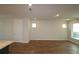 Spacious living room featuring sleek, modern flooring and ample natural light at 6690 Wake St, St Cloud, FL 34771