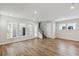 Spacious living room with abundant natural light and wood-look floors throughout at 6690 Wake St, St Cloud, FL 34771