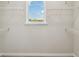 Walk-in closet with window and wire shelving at 6690 Wake St, St Cloud, FL 34771