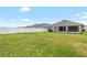 Spacious backyard featuring a well-maintained lawn and a white vinyl fence for privacy at 3839 White Ibis Rd, Lakeland, FL 33811