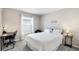 This bedroom is well lit, with plush carpet, neutral colors, and desk for work or study at 3839 White Ibis Rd, Lakeland, FL 33811