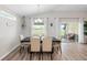 The dining room features lots of natural light and glass sliding door with views of the outdoor living space at 3839 White Ibis Rd, Lakeland, FL 33811