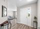 Welcoming entryway with wood flooring and a view into the living area at 3839 White Ibis Rd, Lakeland, FL 33811