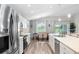 Bright kitchen featuring stainless appliances and adjacent dining area at 3839 White Ibis Rd, Lakeland, FL 33811