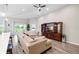 Living room view featuring furniture, television and backyard views at 3839 White Ibis Rd, Lakeland, FL 33811