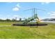 Fun community playground with a slide, climbing structures, and a safe, grassy area for to enjoy at 3839 White Ibis Rd, Lakeland, FL 33811