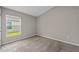 Cozy bedroom featuring neutral paint, carpet flooring, and a bright window at 5933 Slate Rock Dr, Lakeland, FL 33811