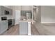 Spacious kitchen featuring gray cabinets, stainless appliances, and central island with countertop at 5933 Slate Rock Dr, Lakeland, FL 33811