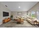 Comfortable living room with neutral decor, ample seating, and lots of natural light at 5933 Slate Rock Dr, Lakeland, FL 33811