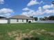 Large, fully fenced backyard featuring a spacious lawn and privacy, perfect for outdoor activities at 206 Samantha Ave, Auburndale, FL 33823