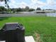 Spacious backyard featuring a well-maintained lawn, privacy fence, and plenty of room for recreation at 206 Samantha Ave, Auburndale, FL 33823
