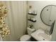 Cozy bathroom with modern fixtures, decorative elements, and neutral tones at 206 Samantha Ave, Auburndale, FL 33823