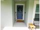 A blue front door welcomes visitors into the home at 206 Samantha Ave, Auburndale, FL 33823
