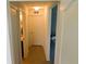 Bright hallway with tiled floors, white doors, and access to other rooms at 206 Samantha Ave, Auburndale, FL 33823