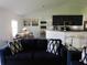 An open living area boasts bright natural light and flows into the kitchen at 206 Samantha Ave, Auburndale, FL 33823