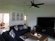 Comfortable living room with vaulted ceiling, fan, modern furniture, decor, and natural light at 206 Samantha Ave, Auburndale, FL 33823