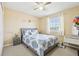 Bedroom featuring neutral walls, carpet and a bed with blue and white patterned bedding at 4422 Evergreen Forest Loop, Kissimmee, FL 34758
