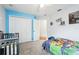 bedroom featuring light blue walls, neutral carpet and Paw Patrol themed bedding at 4422 Evergreen Forest Loop, Kissimmee, FL 34758