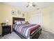 Bedroom featuring natural light, a ceiling fan, and a cozy bed and closet at 4422 Evergreen Forest Loop, Kissimmee, FL 34758