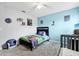 bedroom featuring light blue walls, neutral carpet and Paw Patrol themed bedding at 4422 Evergreen Forest Loop, Kissimmee, FL 34758