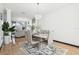 Dining area with modern chandelier, seating for six, with large windows at 4422 Evergreen Forest Loop, Kissimmee, FL 34758