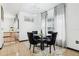 Cozy dining area with stylish black chairs, modern lighting, and adjacent views of other rooms at 4422 Evergreen Forest Loop, Kissimmee, FL 34758