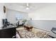 Cozy loft with hardwood floors, plush seating, and a view into other rooms at 4422 Evergreen Forest Loop, Kissimmee, FL 34758