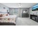 Spacious main bedroom featuring plush carpet, a ceiling fan, and a decorative floral comforter at 4422 Evergreen Forest Loop, Kissimmee, FL 34758