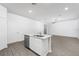 Well-equipped kitchen with stainless steel appliances, granite countertops on island, ample counter space, and natural light at 13291 Tula Loop, Astatula, FL 34705