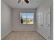 Bright bedroom with ceiling fan, closet, and a window allowing plenty of natural light at 2612 Canyon Crest Dr, Lakeland, FL 33811