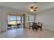 Bright dining area with a ceiling fan, table with seating, and sliding door to patio at 2612 Canyon Crest Dr, Lakeland, FL 33811